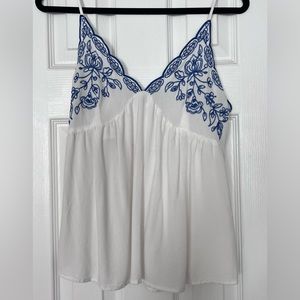 Blue and white babydoll top with adjustable straps in size medium